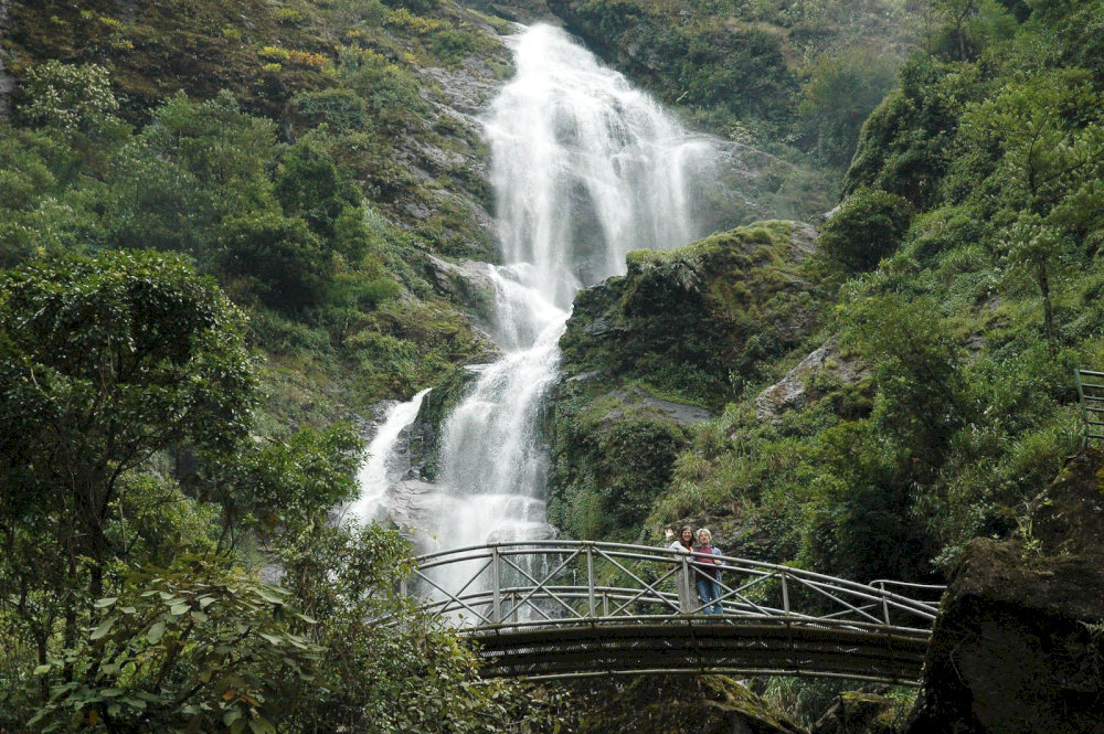 Silver Waterfall in Sapa cascades dramatically through layers of dense forest